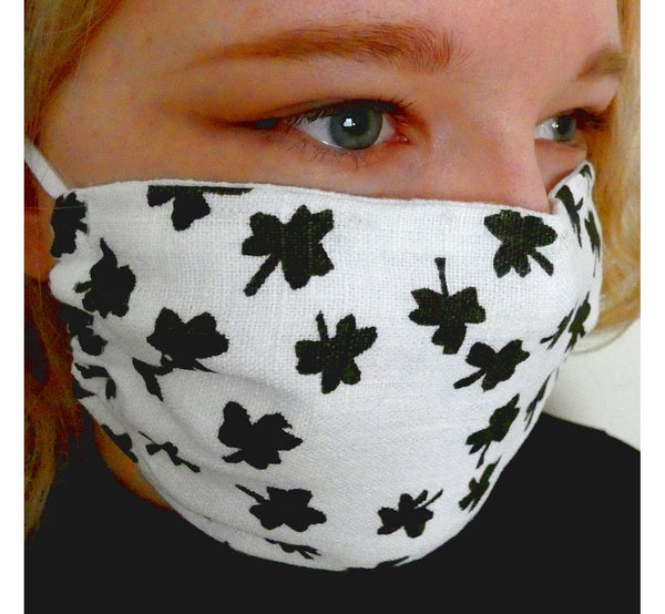 Women wearing handmade double layer face mask, 100% linen fabric, white with hand printed black clover print, face cover