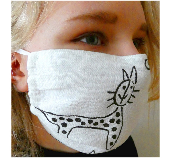 Women wearing handmade double layer face mask, 100% linen fabric, white with hand printed black cat print, face cover