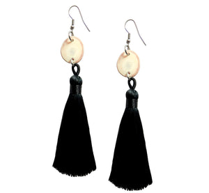 Earrings of round reindeer antler piece with black tassel below, antler 1.7-2.0 cm, 0.67-0.79”, tassel 7.8 cm, 3.07”, handmade. 