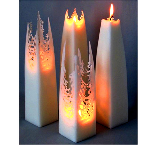 Four white tapered square pillar candles, form a lace-like shape as they melt and creates a magical atmosphere, handmade.